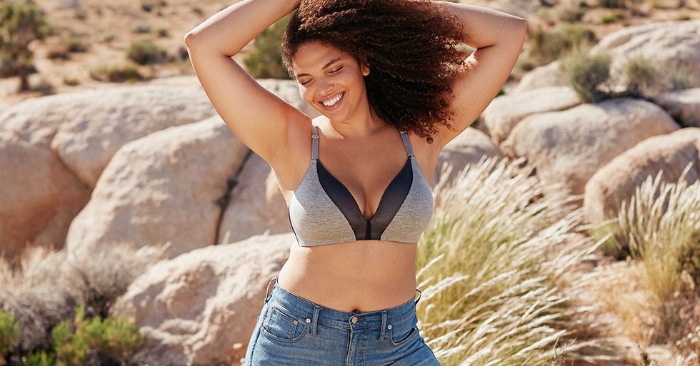 Woman in blue jeans and a grey Lively bra