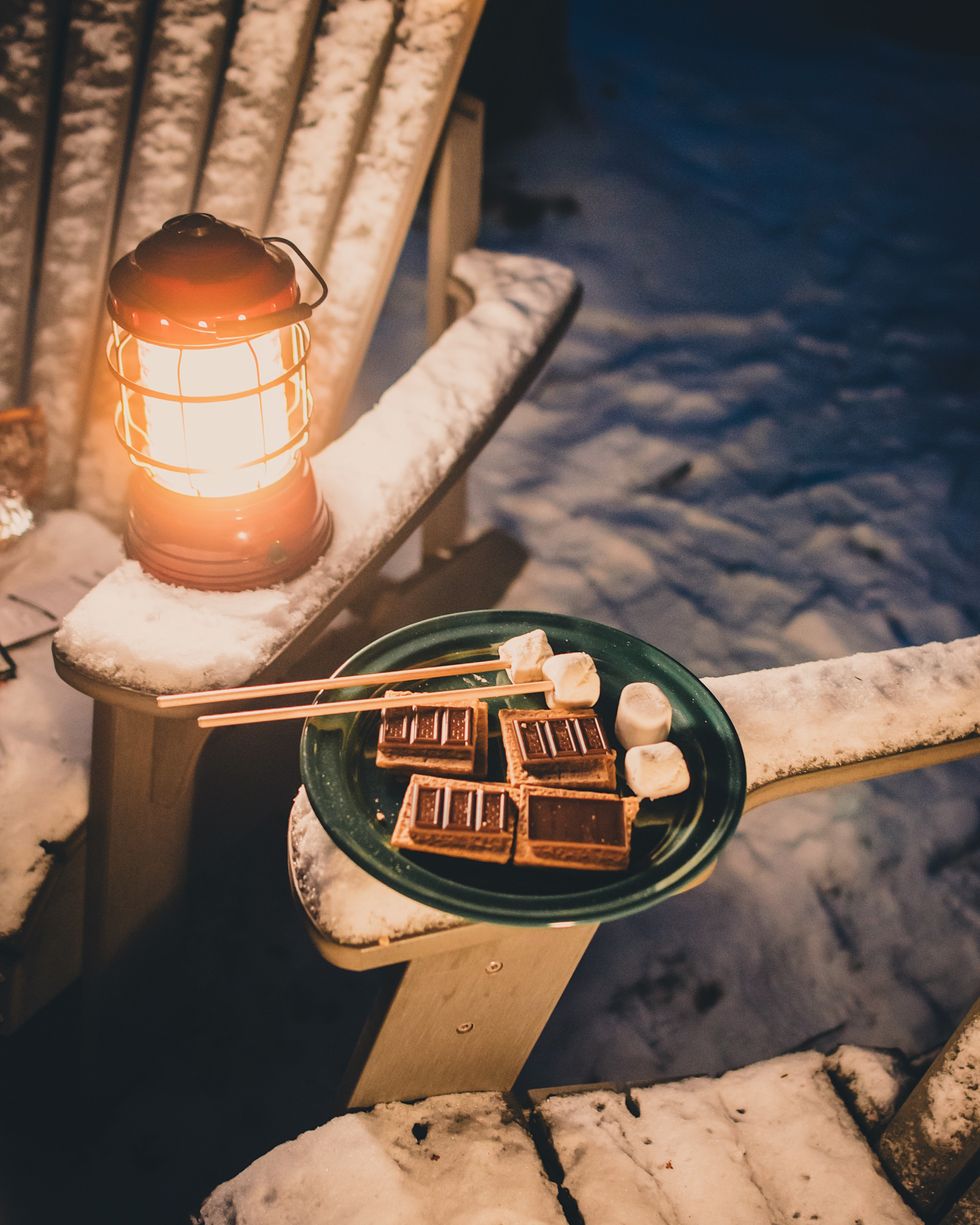 S'mores and lamp outside in the snow