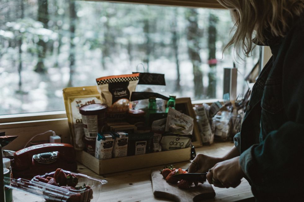 Woman cutting strawberries